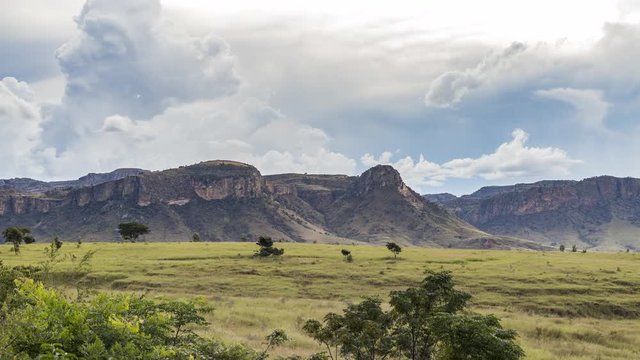 Isalo National Park, Madagascar time lapse. Clouds in the sky above the famous rock formation with grass plain  on the foreground.  