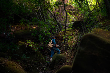 girl backpacker travel in rainforest