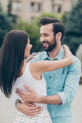 Portrait of charming nice pretty attractive funny cute lovely people millennial bearded blue shirt denim jeans cuddle tender support dress trendy stylish