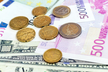 Pack of US dollars and euro banknotes and coins background finance economy currency close up selective focus