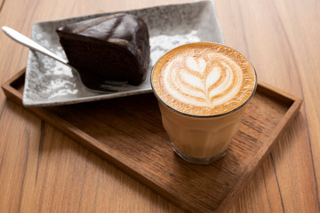 Hot Latte, Latte Art Pattern, Beautiful with cakes on a wooden table
