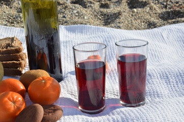 A party on the beach at sunset with wine. Romantic day evening in the summer by the sea. Picnic. copy space,