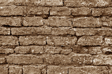 Old grungy brick wall texture in brown tone.