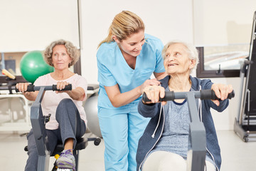 Seniors doing ergometer training in rehab