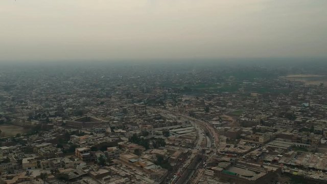 Drone flying over rural population with air pollution