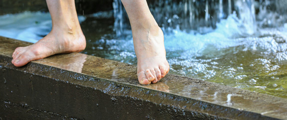 wet feet of a young woman