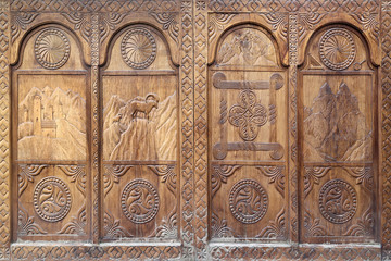 Wooden gates with carved decorative elements.