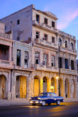 Antique Car driving along Malecon in Havana Cuba