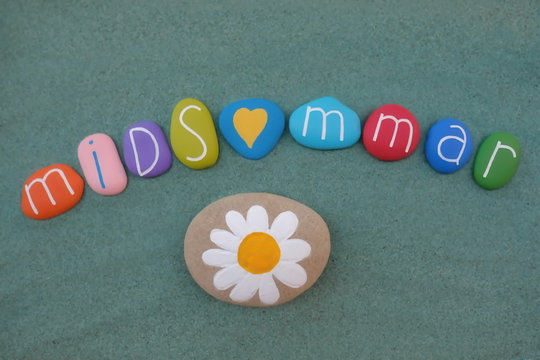21 June, celebrated with multi colored stones over green sand to celebrate Midsommar in Sweden