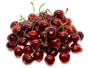 Lots of fresh ripe cherries on a white background