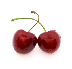 Fresh ripe cherries isolated on white background