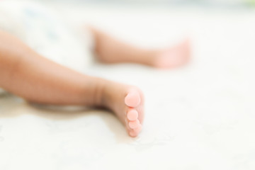 baby feet on white background