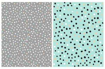 Hand Drawn Irregular Dots Patterns. White, Gold and Black Dots on a Mint Blue Background. White and Gold Spots on a Gray Layout. Infantile Style Repeatable Dotted Vector Design for Textile, Printing.