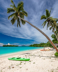 Port Orly sandy beach with palm trees, Espiritu Santo Island, Vanuatu.