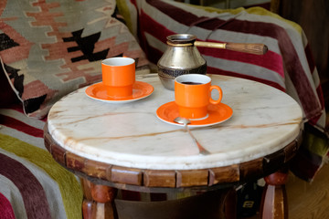 Fototapeta na wymiar Romantic coffee table, two cups of coffee on a marble table.