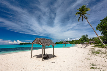 Port Orly sandy beach with palm trees, Espiritu Santo Island, Vanuatu.