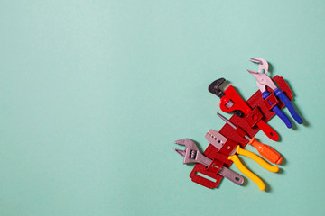 Children's toy plastic tools builder and carpenter. Children's tool: screwdriver, pliers, clamp, adjustable wrench. Selective focus.