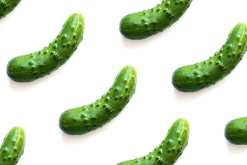 Pattern of cucumbers isolated on white background. Flat lay.