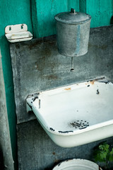 Street washbasin in a rural house. Retro style from russian village