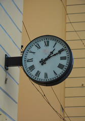 Clock on the wall of the house