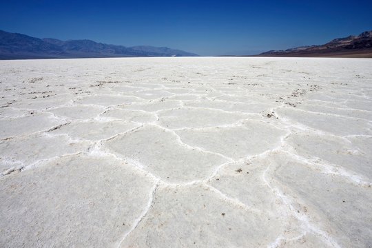 Salt crust in Badwater Basin salt pan, lowest point in North America, Panamint Range left, Black Mountains, Death Valley, Mojave Desert, California, USA, North America