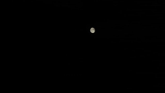 moon mooving in the dark sky