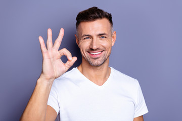 Close up photo amazing he him his middle age macho perfect appearance hand arm raised okey symbol...