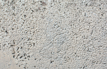 A lot of paint on the surface. Relief texture. Light background