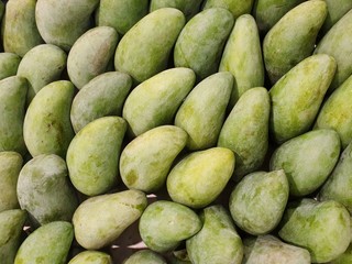Top view of fresh green mango as a background in the supermarket at Thailand (Mangifera indica), Tropical fruit