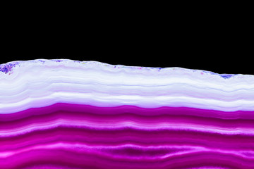 Purple violet agate slice striped mineral isolated on black, abstract background