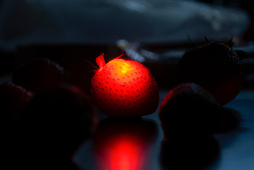 Strawberry flamy in black background