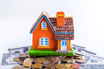 house model background with coins, money saving and investment concept 