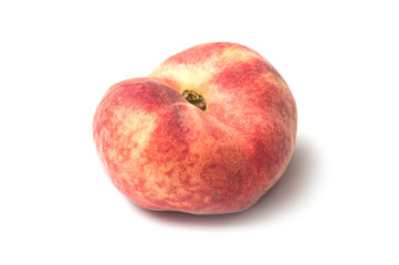 Fototapeta na wymiar Closeup of organic flat peach on white background