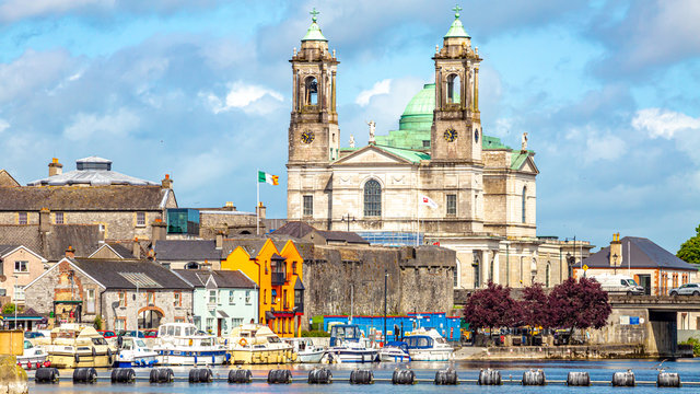 Beautiful view of the parish church of Ss. Peter and Paul and the castle in the town of Athlone next to the river Shannon, wonderful cloudy day in the county of Westmeath, Ireland