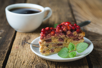 A piece of homemade cake with fresh strawberries