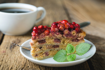 A piece of homemade cake with fresh strawberries