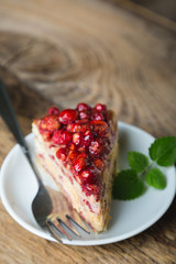 A piece of homemade cake with fresh strawberries