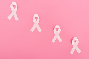 flat lay with pink breast cancer signs on pink background