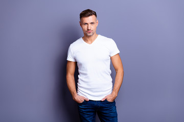 Fototapeta na wymiar Close up photo amazing he him his middle age macho perfect appearance easy-going reliable person hands arms pockets wear casual jeans denim pants trousers white t-shirt isolated grey background