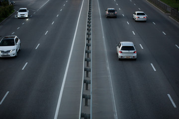 asphalt road with marking lines and cars. view from above
