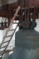 Vologda Russia, ornately engraved bell and interior of the bell tower at Saint Sophia Cathedral