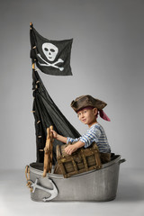 Boy play pirate on the ship