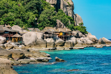 Tropical, paradise island with turquoise water Koh Tao, Thailand. Stone Beach with Bungalows
