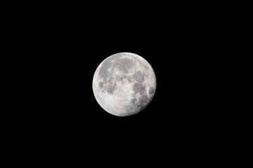 Large white full moon on black night sky,The Moon is an astronomical body that orbits planet Earth, being Earth's only permanent natural satellite