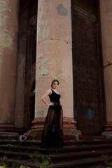 Young attractive woman in sexy see-through, transparent, transpicuous, diaphanous, clear black...