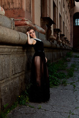 Young attractive woman in sexy see-through, transparent, transpicuous, diaphanous, clear black...