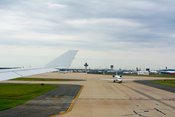Fototapeta na wymiar Airplane Taxiing on the Runway at the Airport Before Taking off