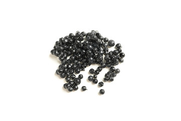 Black caviar isolated on white background, closeup