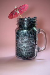 Jar of blueberries on a pink background 3