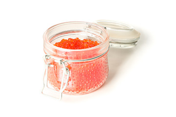 Glass jar with caviar isolated on white background